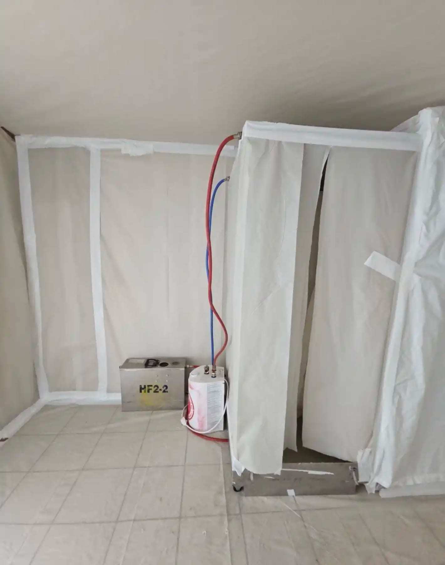 Plastic containment chamber built inside a room with the flooring removed