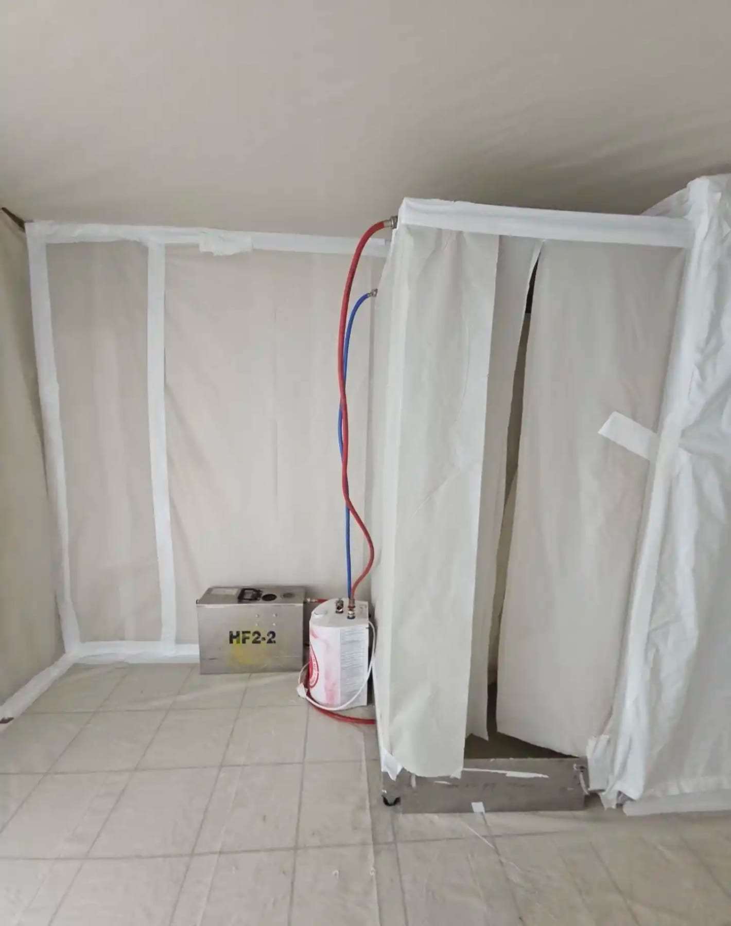 Plastic containment chamber built inside a room with the flooring removed